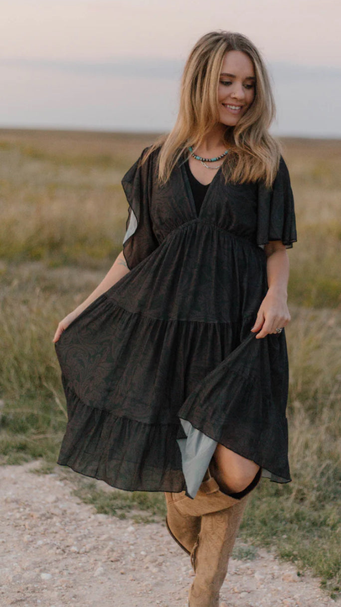 The TOOLED IN BLACK DRESS